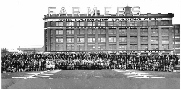 Auckland Farmers Staff gather for a photograph in 1930 to celebrate the company's 21st birthday